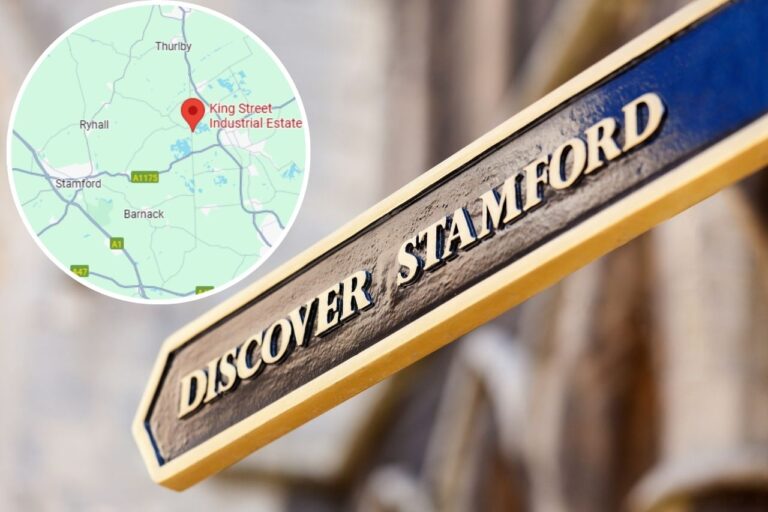 Sign post for Stamford with a map to an industrial estate